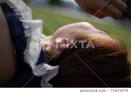 Profile of a woman lying down Profile of a woman lying down 73425079