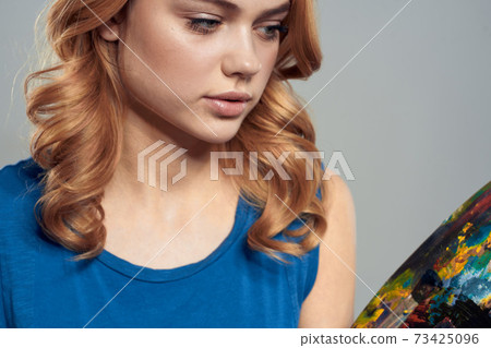 Woman artist palette with brushes in hands close-up art creativity Woman artist palette with brushes in hands close-up art creativity 73425096