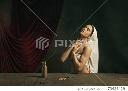 Modern remake of classical artwork with coronavirus theme - young medieval woman on dark background Modern remake of classical artwork with coronavirus theme - young medieval woman on dark background 73425429