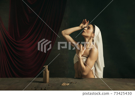 Modern remake of classical artwork with coronavirus theme - young medieval woman on dark background 73425430