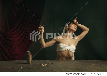 Modern remake of classical artwork with coronavirus theme - young medieval woman on dark background Modern remake of classical artwork with coronavirus theme - young medieval woman on dark background 73425433
