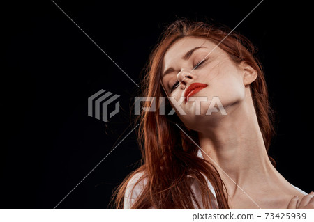 beautiful woman elegant style red lips unbuttoned white shirt close-up black background beautiful woman elegant style red lips unbuttoned white shirt close-up black background 73425939