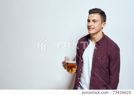 Man with a mug of beer fun alcohol lifestyle shirt light background Man with a mug of beer fun alcohol lifestyle shirt light background 73426629