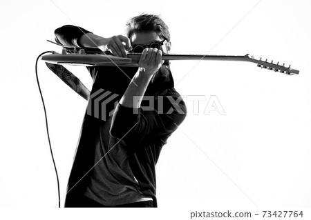 Musician with guitar rock star emotions entertainment modern performer 73427764