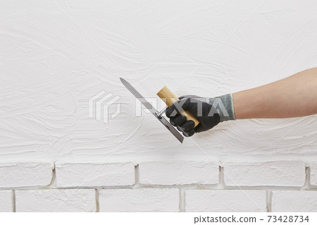Plasterer, hand Plasterer, hand 73428734