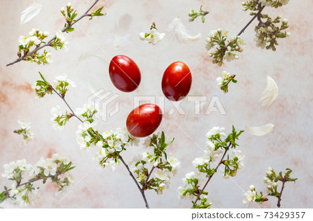 Creative Easter compisition - natural colored eggs and spring flowers flying on beige background Creative Easter compisition - natural colored eggs and spring flowers flying on beige background 73429357