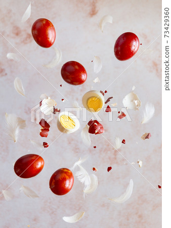 Easter levitation concept with colorful eggs, vertical 73429360