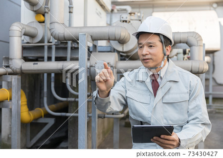 People working in the factory People working in the factory 73430427