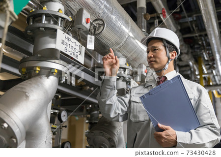 People working in the factory 73430428