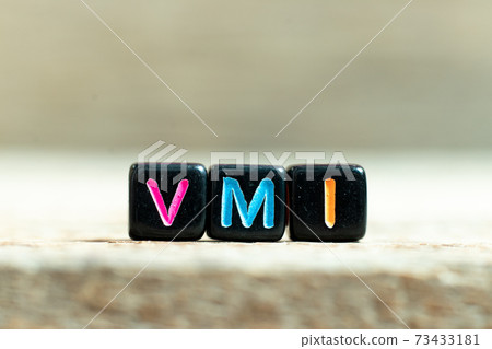 Black color block with word VMI (abbreviation of vendor managed inventory) on wood background Black color block with word VMI (abbreviation of vendor managed inventory) on wood background 73433181