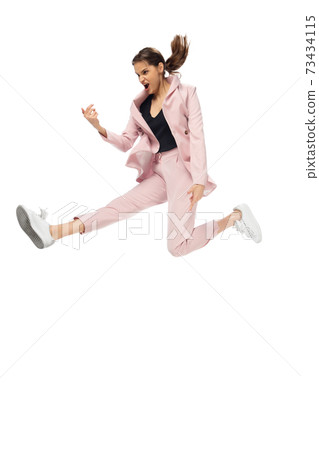 Happy young woman dancing in stylish clothes or suit, remaking legendary moves of celebrity from culture history Happy young woman dancing in stylish clothes or suit, remaking legendary moves of celebrity from culture history 73434115
