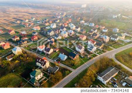 Aerial view of home roofs in residential rural neighborhood area. 73434148