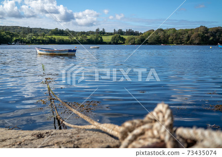 Rowing boat at the pier in Bruckless in County Donegal - Ireland. Rowing boat at the pier in Bruckless in County Donegal - Ireland. 73435074
