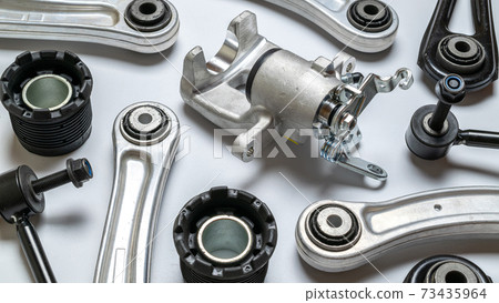 Car service. Auto motor mechanic spare or automotive piece on white background. Set of new metal car part. Technology of mechanical gear. 73435964