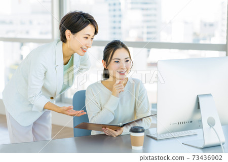 Business woman teaching work in the office Business woman teaching work in the office 73436902