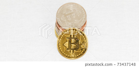 Bitcoin coins pilled on top of each other with white background Bitcoin coins pilled on top of each other with white background 73437148