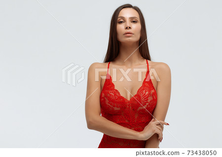 Sexy woman in lace bodysuit in studio 73438050