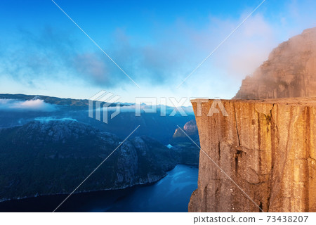 Misty morning on Preikestolen Misty morning on Preikestolen 73438207