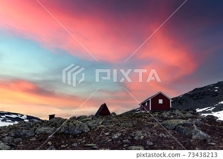 Typical norwegian red wooden house 73438213