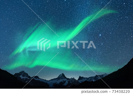 Northern lights in winter mountains Northern lights in winter mountains 73438220