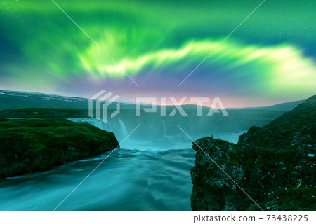 Aurora borealis Northern lights over Kirkjufellsfoss waterfall Aurora borealis Northern lights over Kirkjufellsfoss waterfall 73438225
