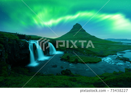 Aurora borealis Northern lights over Kirkjufellsfoss waterfall Aurora borealis Northern lights over Kirkjufellsfoss waterfall 73438227