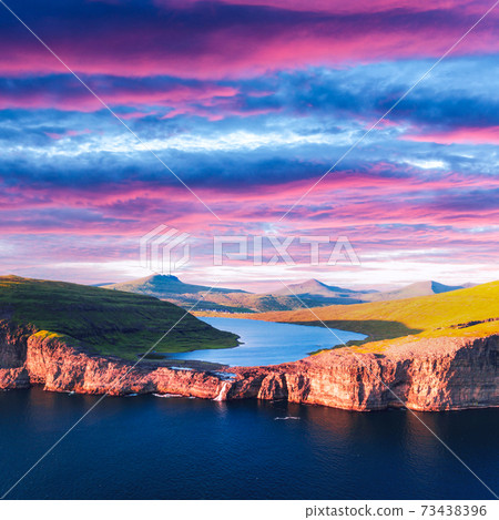 Sorvagsvatn lake on cliffs of Vagar island in sunset, Faroe Islands Sorvagsvatn lake on cliffs of Vagar island in sunset, Faroe Islands 73438396