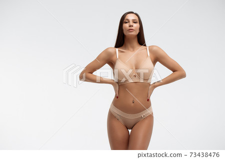 Slim woman in lingerie in studio 73438476