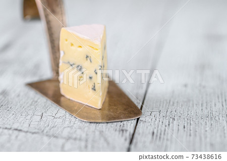 Blue cheese with white mould Blue cheese with white mould 73438616