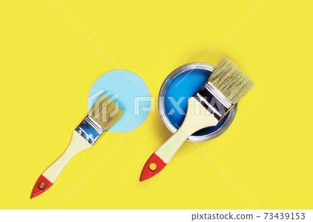 Colored background with paint jar and brushes. 73439153