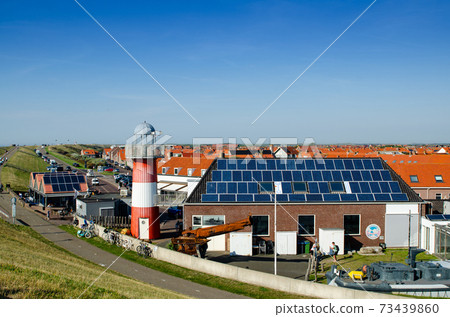 Westkapelle, Netherlands, August 2019. One of the lighthouses in the built-up area. Westkapelle, Netherlands, August 2019. One of the lighthouses in the built-up area. 73439860