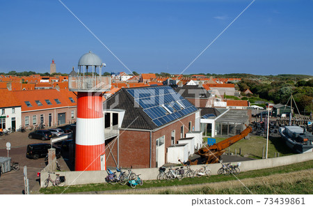 Westkapelle, Netherlands, August 2019. One of the lighthouses in the built-up area. Westkapelle, Netherlands, August 2019. One of the lighthouses in the built-up area. 73439861