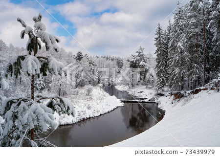 Beautiful snowy winter landscape of forest river Isloch, Minsk region, Belarus. Beautiful snowy winter landscape of forest river Isloch, Minsk region, Belarus. 73439979