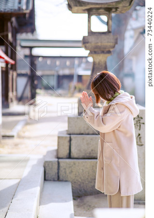 Alafor housewife praying with hands together 73440224