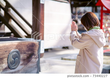 Alafor housewife praying with hands together 73440227