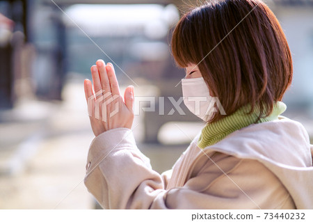 Alafor housewife praying with hands together 73440232