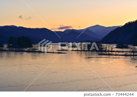 Morning on Lake Urabandai Akimoto with thin ice 73444244