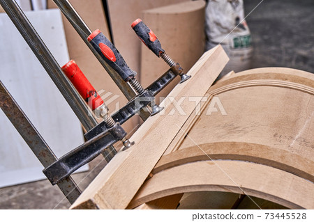 Curved cabinet door. Wooden furniture manufacturing process Curved cabinet door. Wooden furniture manufacturing process 73445528