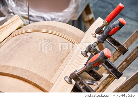 Curved cabinet door. Wooden furniture manufacturing process Curved cabinet door. Wooden furniture manufacturing process 73445530