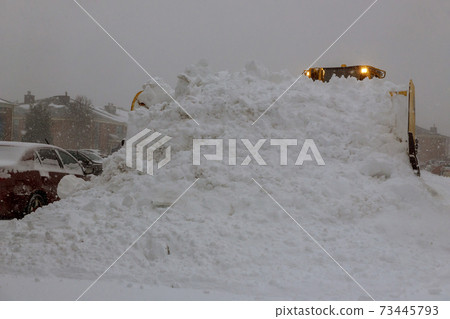 Winter the snow removal vehicle removing snow way after heavy snowfall 73445793