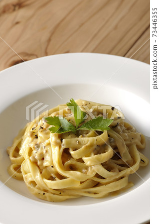 Flat pasta with truffle cream with trefoil 73446355