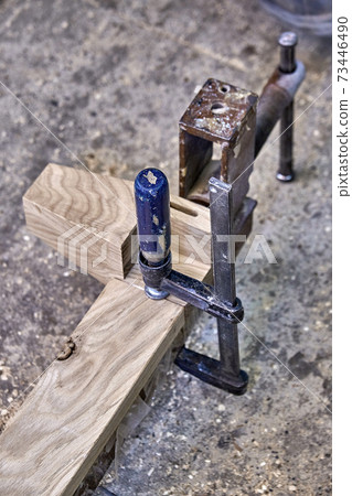 Joinery. Wooden legs made with solid oak. Furniture legs building process. Wooden furniture manufacturing process 73446490