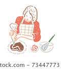 A woman squeezing cream on a homemade chocolate cake 73447773