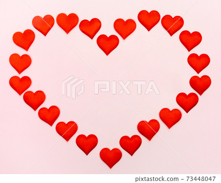 Big heart of small hearts with mock-up on a pink background. Concept of holidays and Valentines Day 73448047