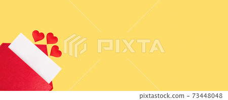 Banner red open envelope with a sheet of paper with a hearts on a yellow background with mock-up. Valentines day holidays concept and love notes, christmas and new year letters for Santa Claus 73448048