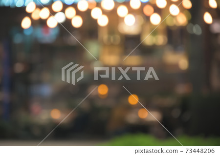 Blurred image of bar or cafe at night background. 73448206