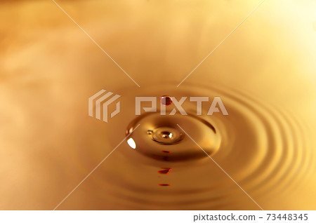 Ripples of water drops brown coffee 73448345