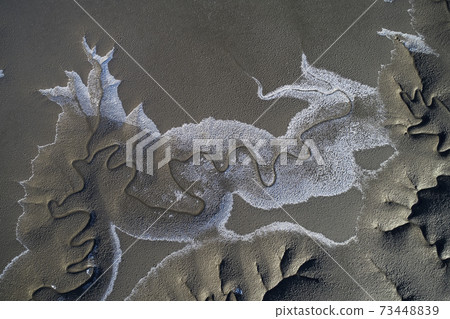 A picture drawn on the shore 73448839