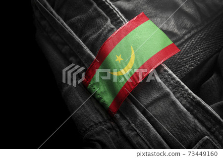 Tag on dark clothing in the form of the flag of the Mauritania Tag on dark clothing in the form of the flag of the Mauritania 73449160