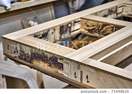 Joinery. Wood door manufacturing process. Door frame. Furniture manufacture Joinery. Wood door manufacturing process. Door frame. Furniture manufacture 73449620